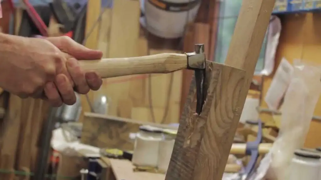 What is an Adze and What Is It Used For? 2 An adze in use woodworking