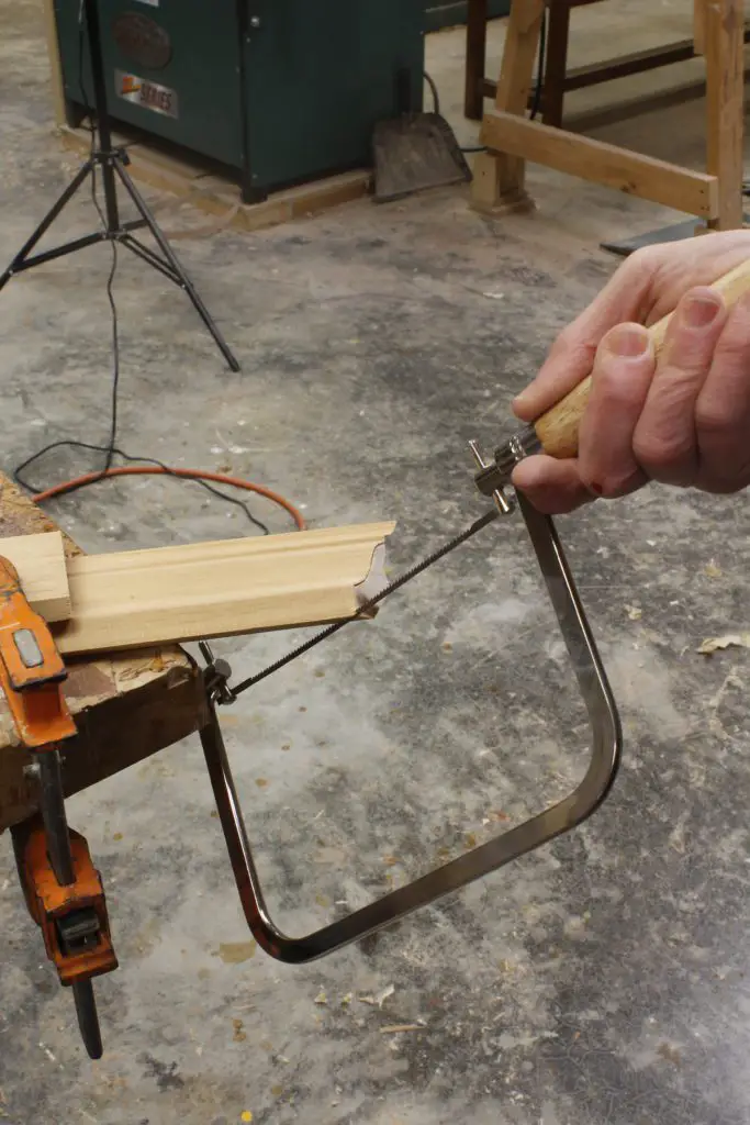use a coping saw to cut at 45 degree angle