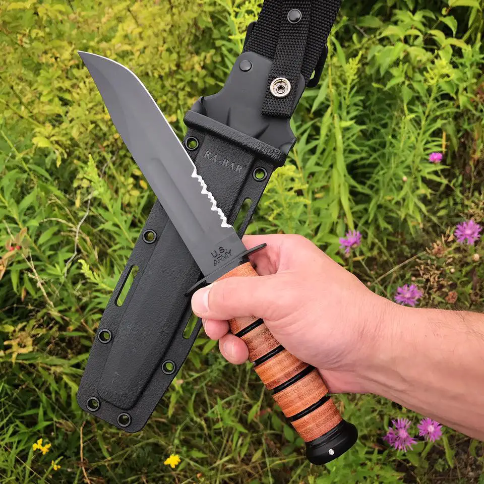 KA-BAR Marine Corp Knife in the field with the black plastic sheath