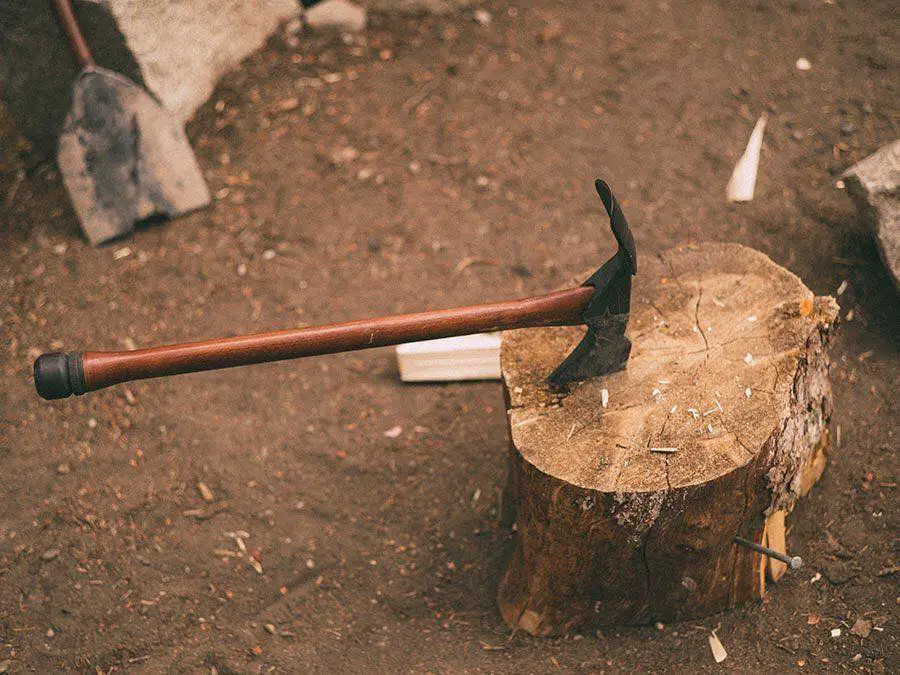 pulaski axe stuck in a chopping block