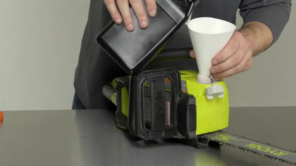 Everything You Need to Know About Chainsaw Bar Oil 3 replace the oil in a chainsaw with a funnel